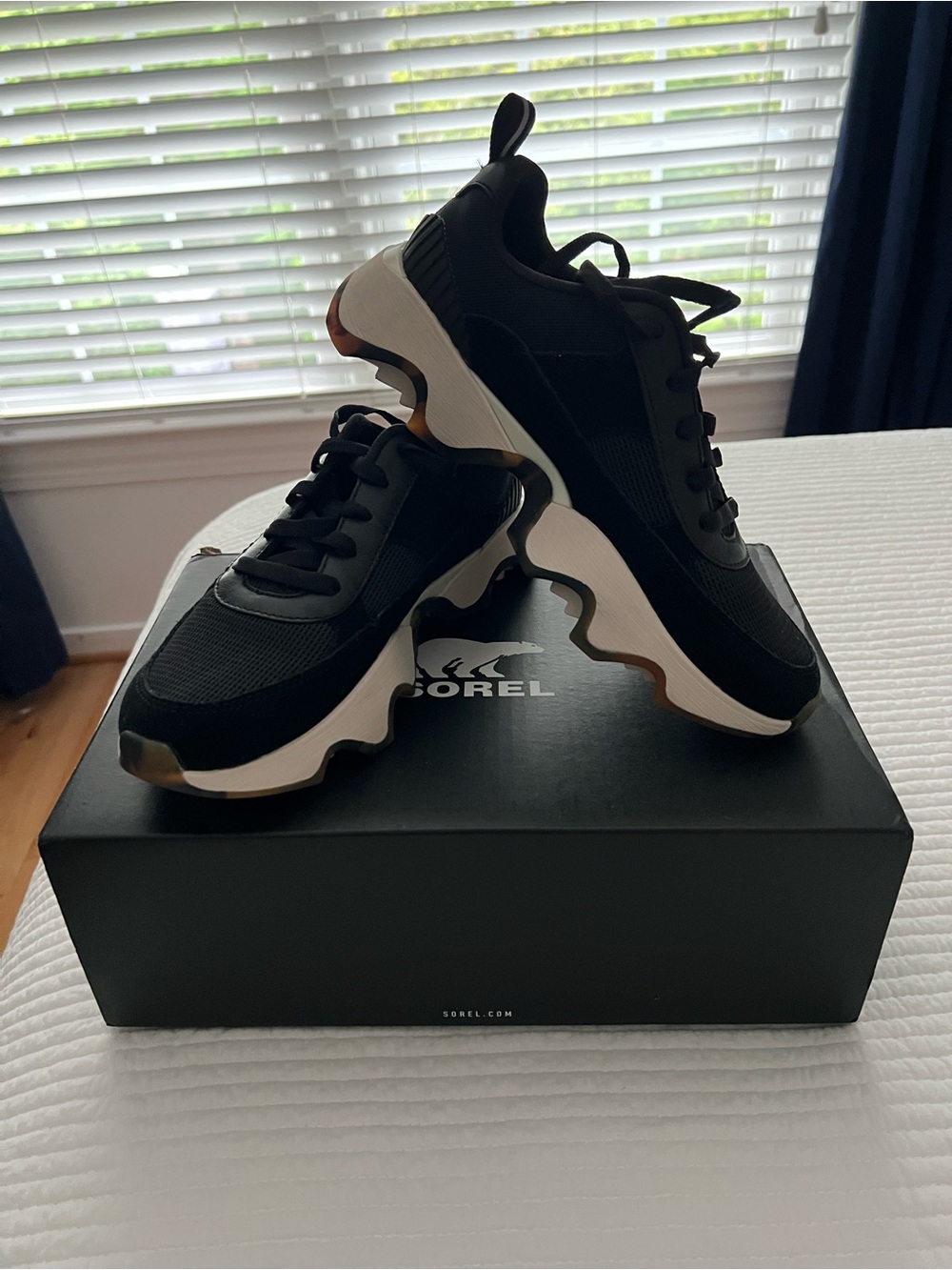 Sorel Kinetic  Black and White Tortoise Accent Sneaker